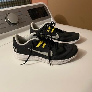 Black Nike running shoes.